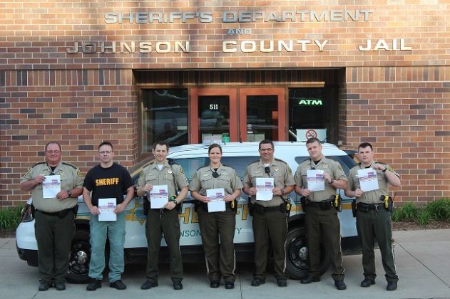 Deputies lined up in front of the Johnson County Sheriff building