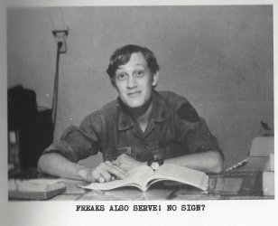 Bill Blanchard reading a book at a desk