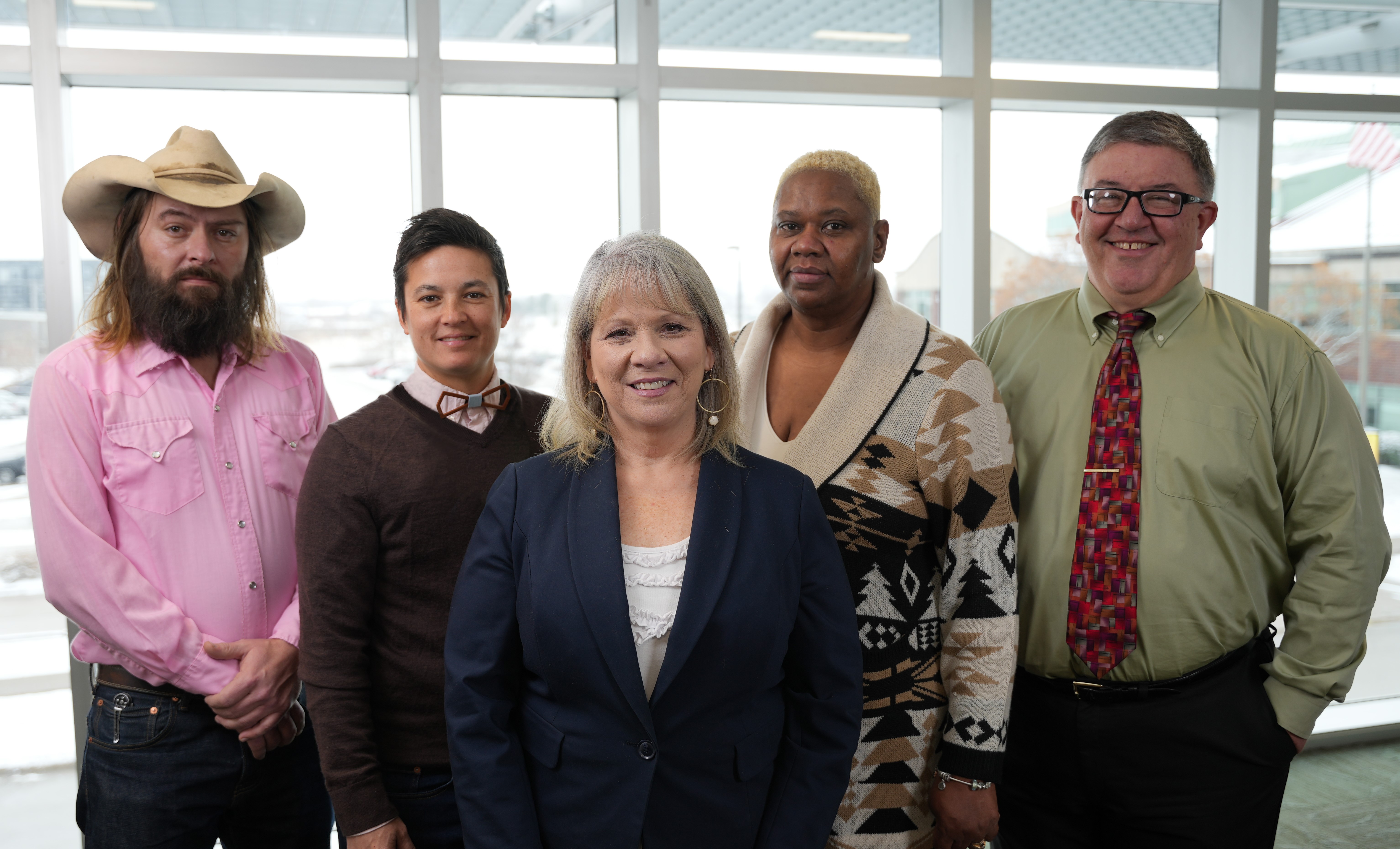 The Johnson County Board of Supervisors poses for a picture indoors. 