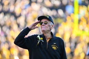 photo of Bob Williams saluting at Kinnick Stadium