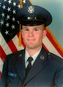 Chad Gerdes's Air Force ID photo in front of the American flag