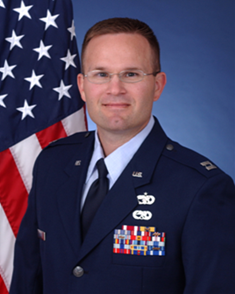 Chad Gerdes's updated Air Force ID photo infront of the American flag