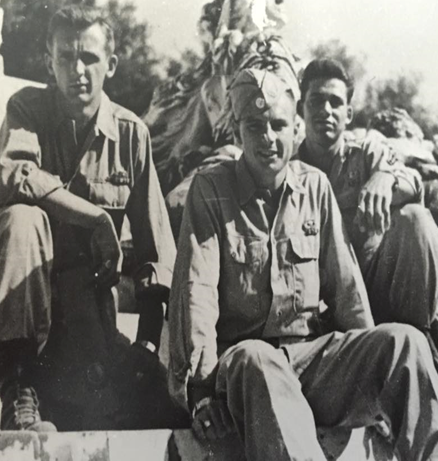 Clement McConville sitting with fellow soliders
