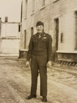 Dale Watt standing outside a building in his military uniform