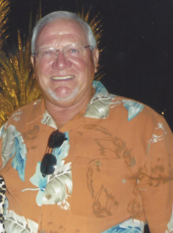 Duane Papke years later wearing a orange shirt with feathers on them