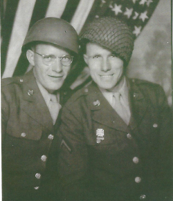 Edward Barnes with fellow solider standing in front of the American Flag
