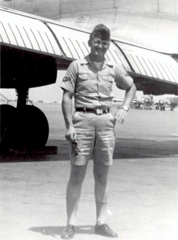Gary Kellogg standing in front of an airplane wearing his summer Air Force  uniform