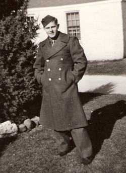 J.E. Brandstatter standing outside next to a tree