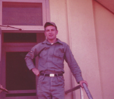 Jim Wells standing on a porch in his Air Force uniform