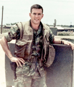 John Gough standing outside in his Marines field uniform