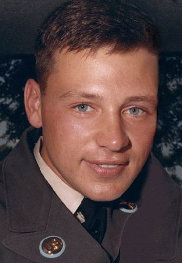John Kamp smiling in his Army uniform in an upclose photo