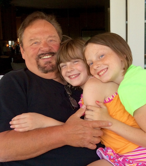John Camp years later with his 2 granddaughters