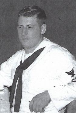 Keith Lackore sitting in  his Navy uniform