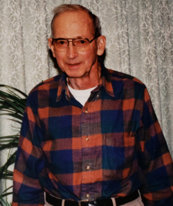 Leo Petrik years later wearing a blue and orange checkers button up shirt