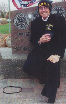 Mark Wilson at the memorial next to his brick