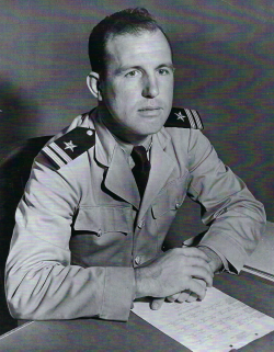 Photo of Max Hawkins sitting at a table with a piece of paper in front of him