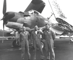 Michael Perino standing with 2 fellow airmen in front of an airplane