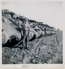 Patrick Fountain standing in front of tanks