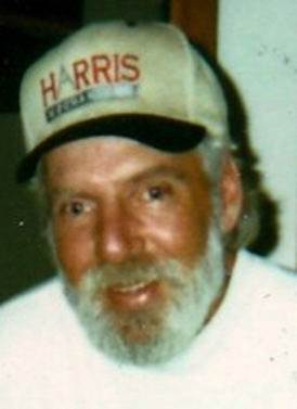 Pat McConville years later wearing a white hat with the work Harris on it