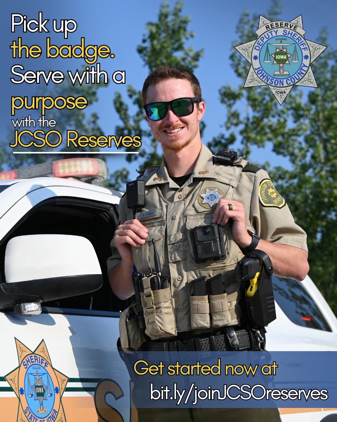 A Johnson County Sheriff's Office Reserve Deputy stands in his uniform smiling in front of his patrol car. Pick up the badge. Serve with a purpose with the JCSO Reserves.