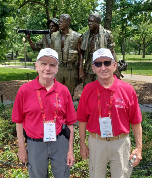 photo of Ron Reihman in front of a memorial in Washington D.C.