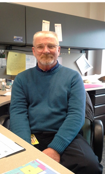 Ronald Moore years later sitting at his desk