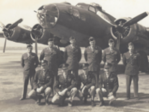 Harold Ruppert and fellow Air Man standing in front of an Air Corps plane