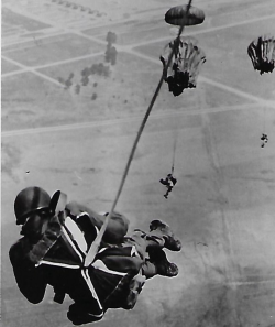 Leo Tomash parachuting out of a plane