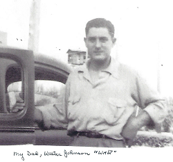photo of Walter Johnson standing next to a car.