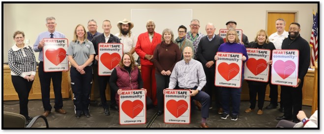 Johnson County community partners accepting their HEARTSafe Community signs